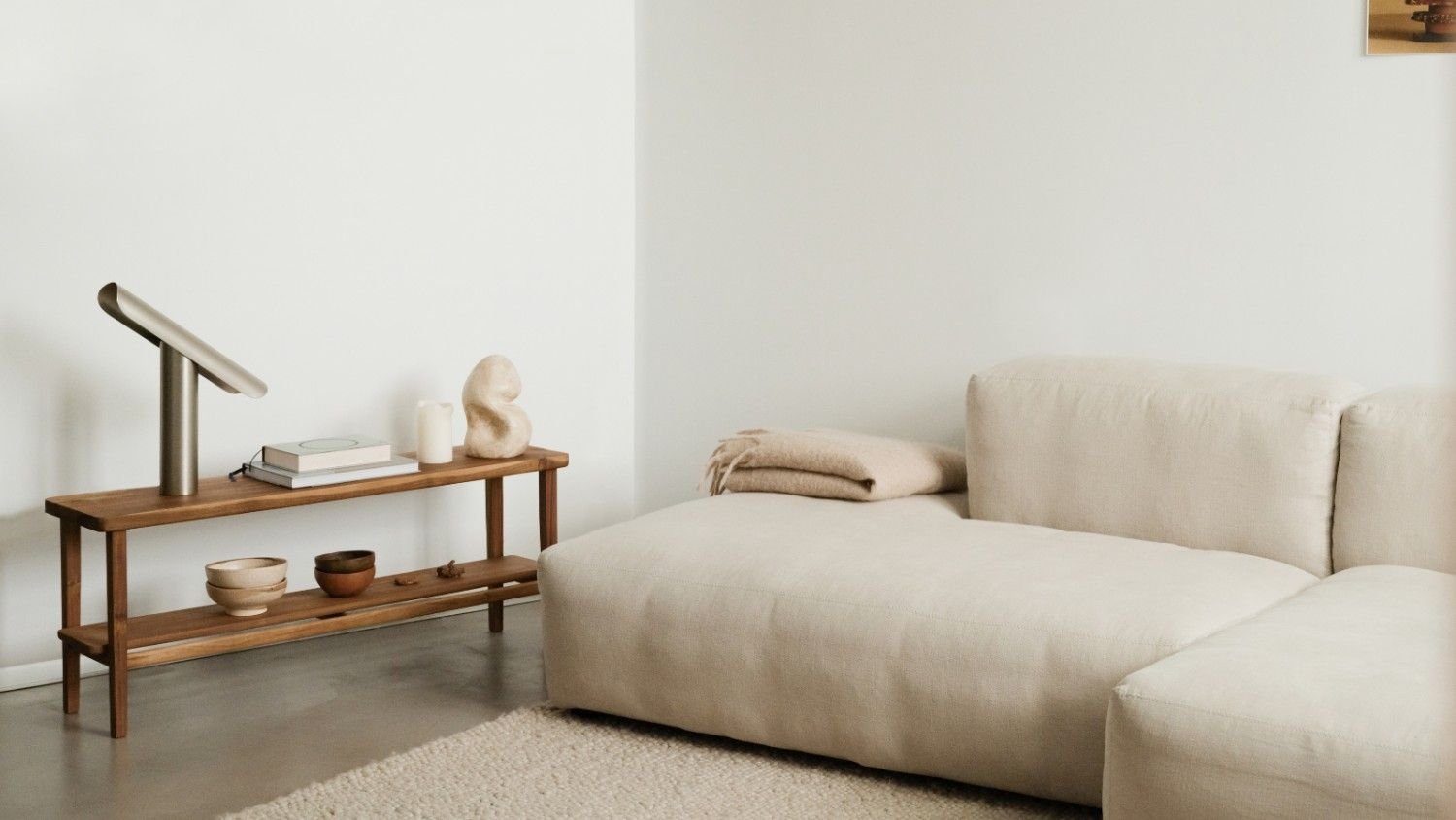 Minimalist beige sofa and wooden console