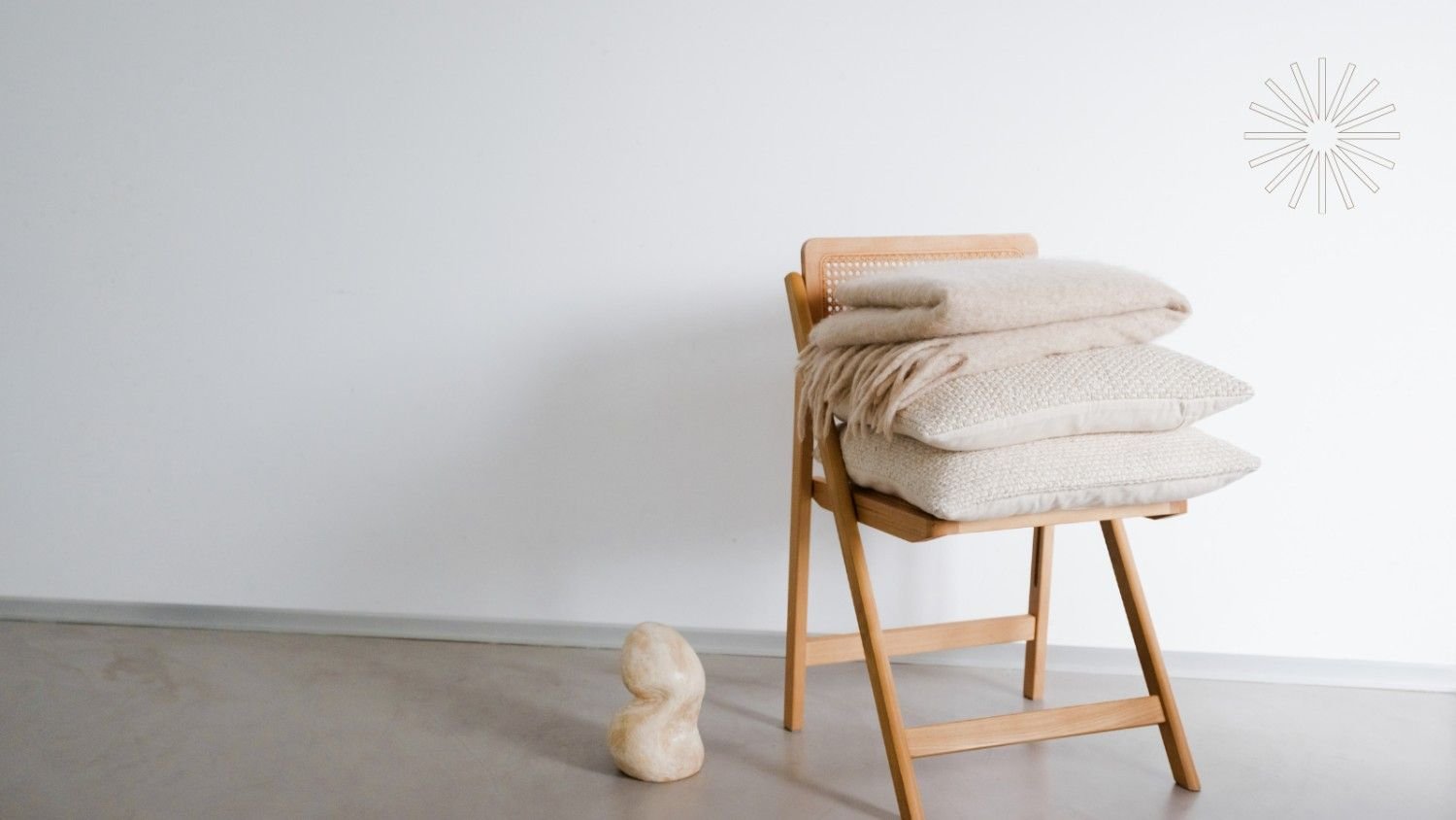 Wooden folding chair with textured cushions