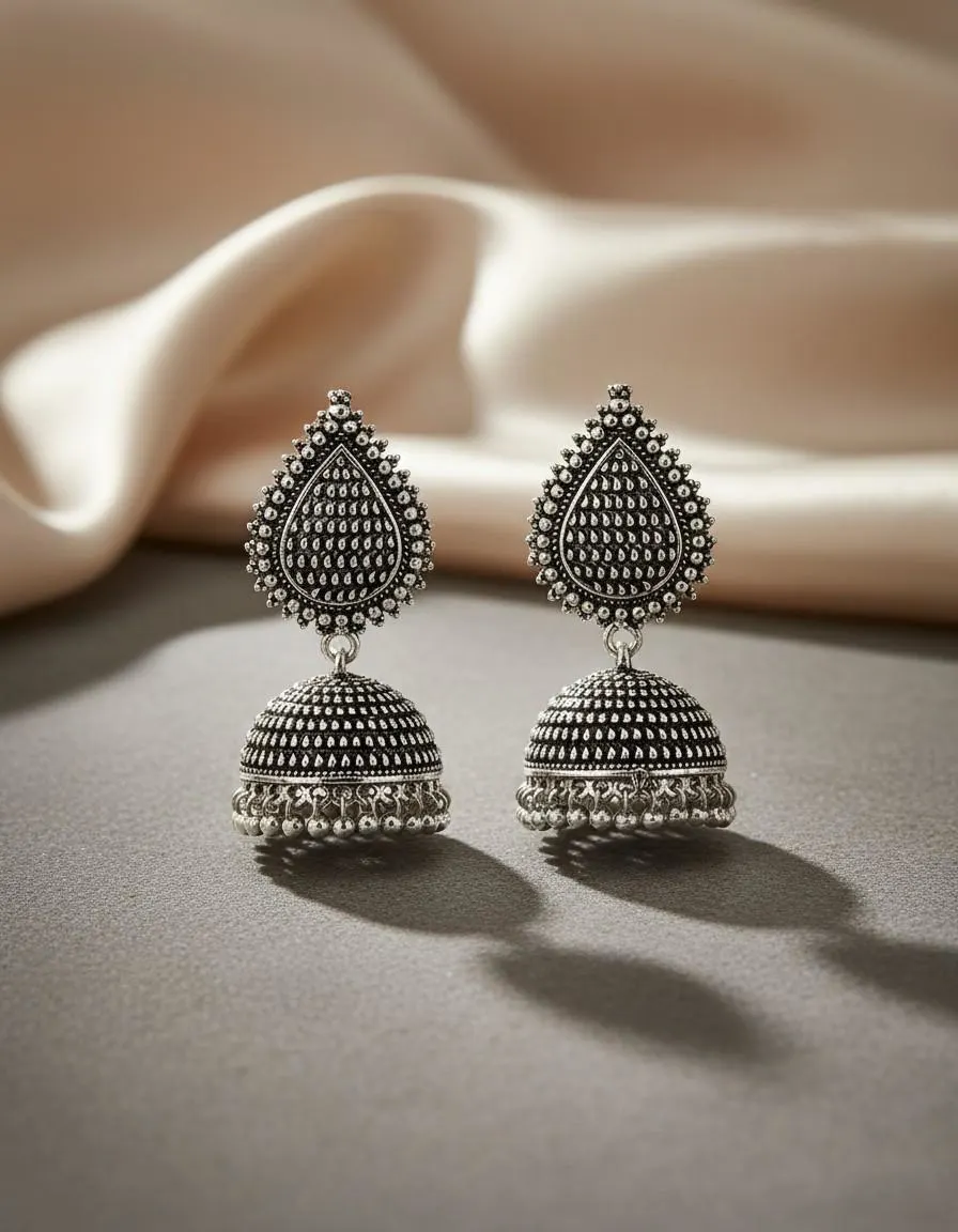 Side profile showing the dome shape sitting near the jawline wearing Teejh oxidised jhumkas Teejh KapdeWali