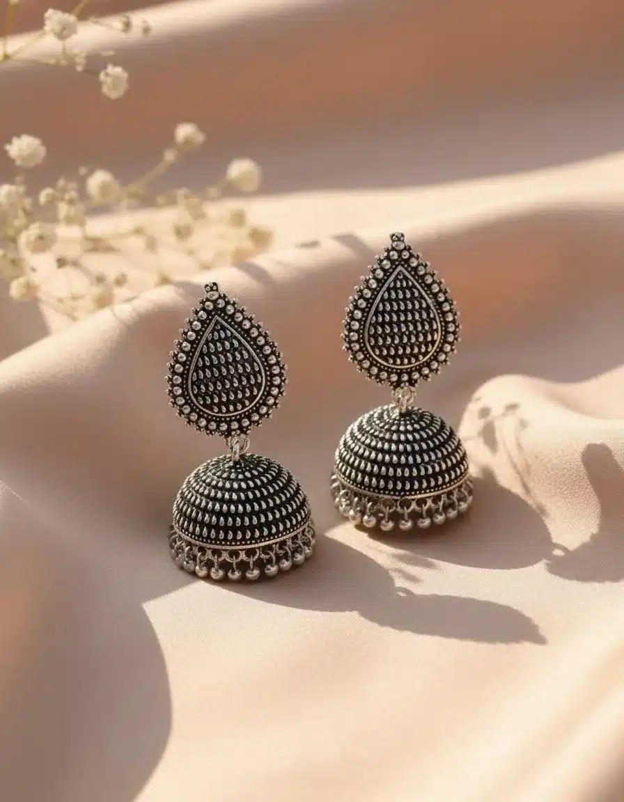 Detail of the sturdy post and small butterfly back on Teejh oxidised jhumkas Teejh KapdeWali